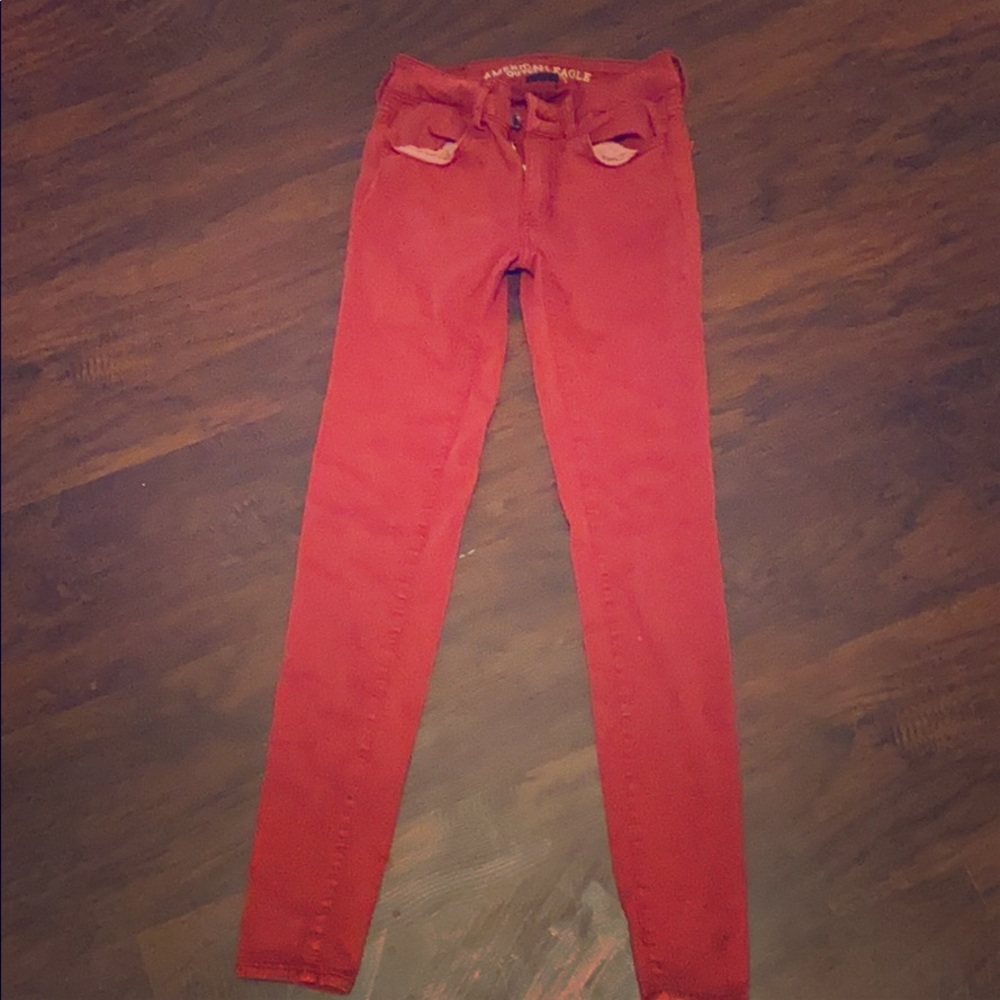 A red pair of American Eagle jeans